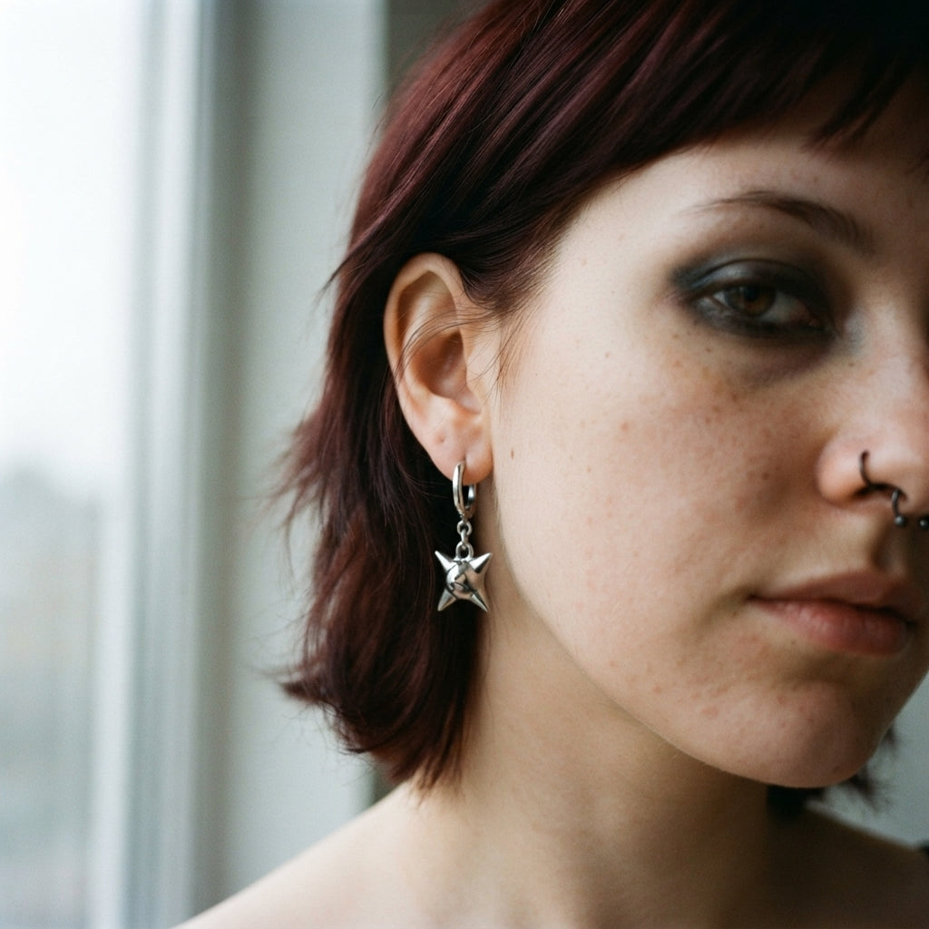 Spiked Orb Star Huggie Earrings