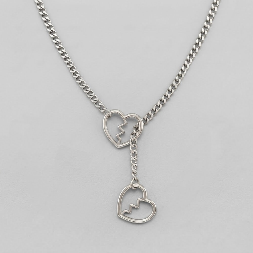Ketting met curb-schakels, gebroken hartenring en lariat-hanger