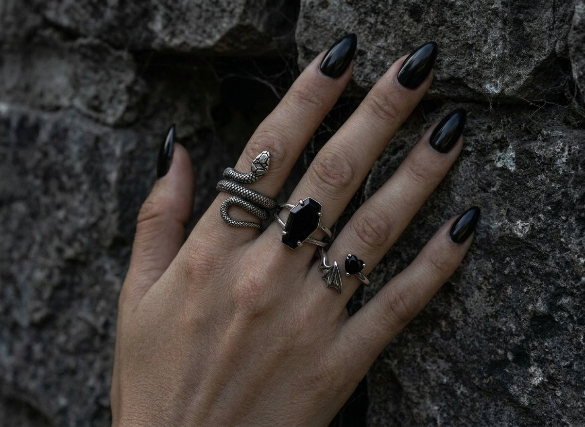 Hand wearing stacked stainless steel rings