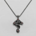 Snake and Skull Cross Necklace with Red Gemstones