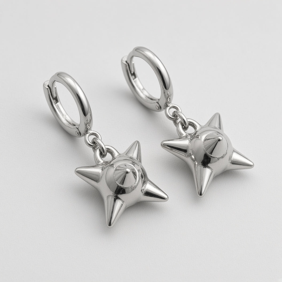 Spiked Orb Star Huggie Earrings
