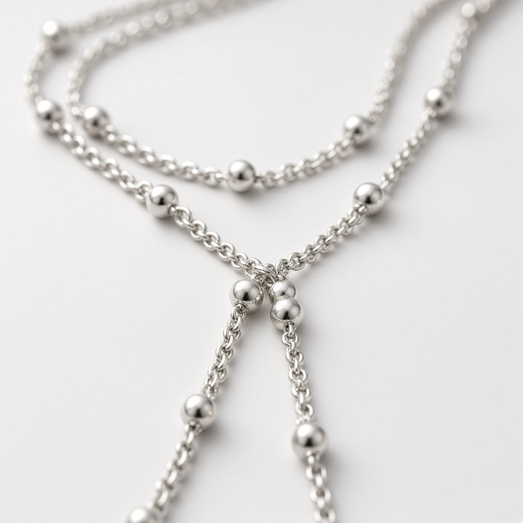 Zilverkleurige dubbele kralenketting met lariat-hanger